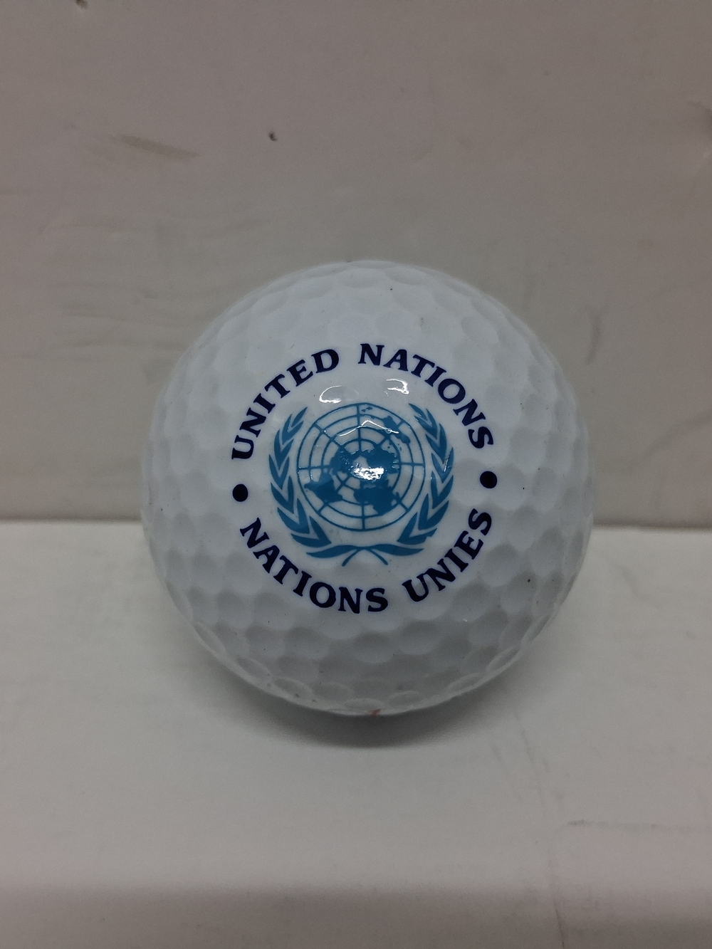 United Nations Branded White Golf Ball with Blue Logo